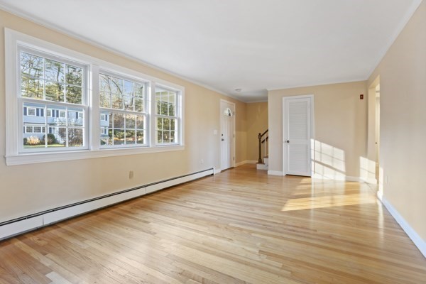 88 Wright Road Concord, MA 01742 - Photo 21 of 42 a view of empty room with wooden floor and fan