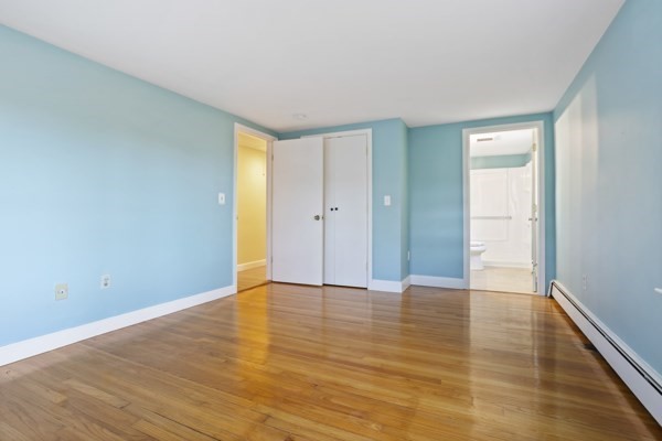 88 Wright Road Concord, MA 01742 - Photo 26 of 42 a view of an empty room with wooden floor