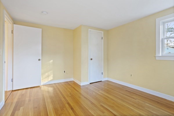 88 Wright Road Concord, MA 01742 - Photo 28 of 42 a view of an empty room with wooden floor and a window