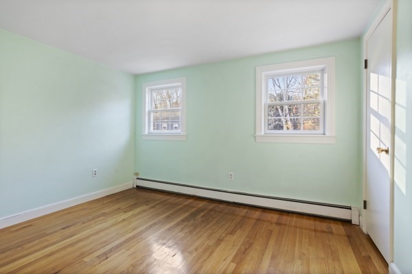 88 Wright Road Concord, MA 01742 - Photo 31 of 42 an empty room with wooden floor and windows