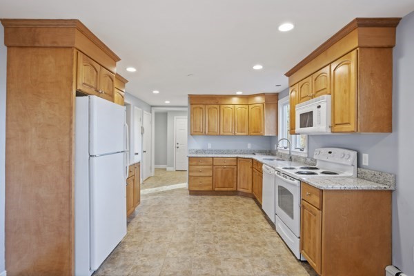 88 Wright Road Concord, MA 01742 - Photo 7 of 42 a large kitchen with a refrigerator a sink and dishwasher