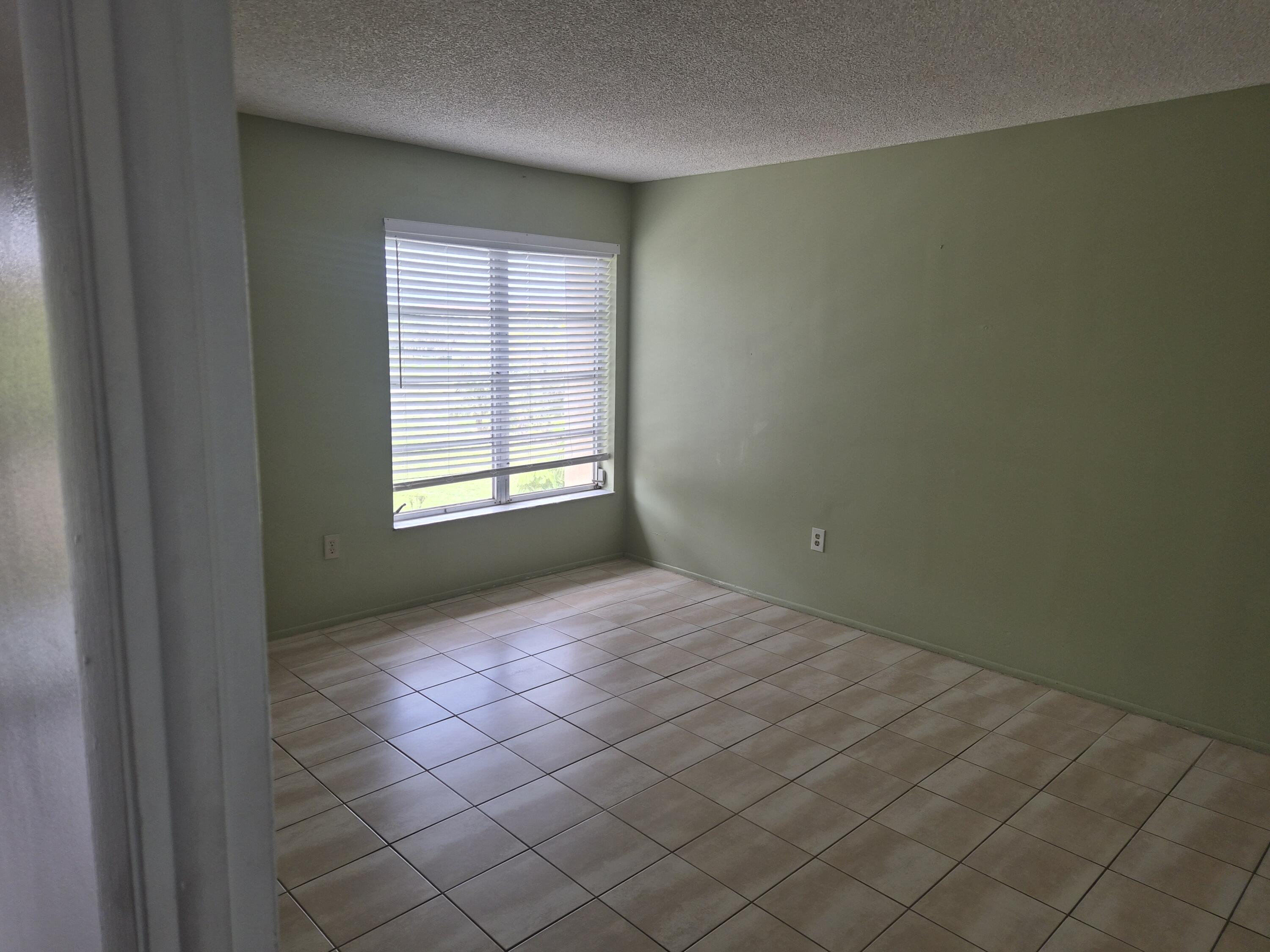 4166 Inverrary Drive, Unit 403 Lauderhill, FL 33319 - Photo 17 of 32 an empty room with windows
