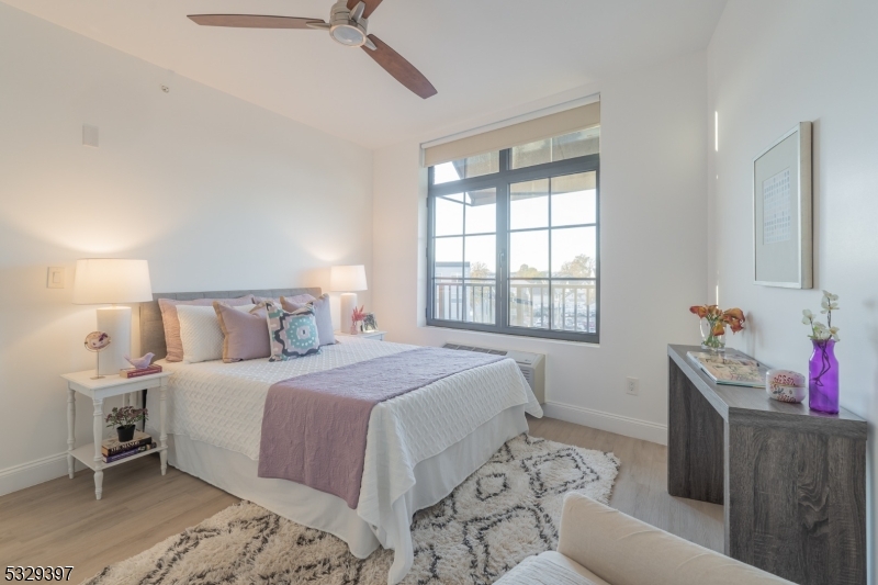 1026 Stuyvesant Avenue, Unit 207 Union, NJ 07083 - Photo 6 of 11 a bedroom with a bed and a window