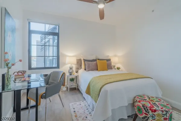 a bedroom with a bed and a table in it