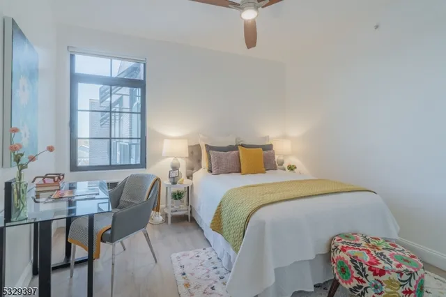 a bedroom with a bed and a table in it