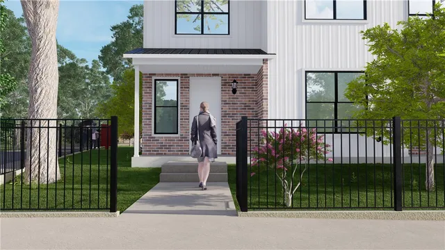 a view of a house with a small yard and plants