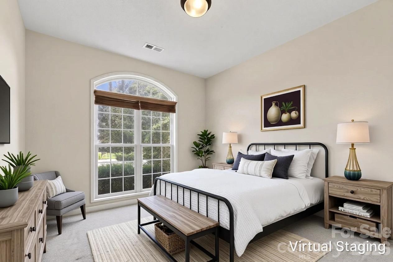 268 Farm Valley Road Fletcher, NC 28732 - Photo 25 of 30 a bedroom with a bed a potted plant and a window