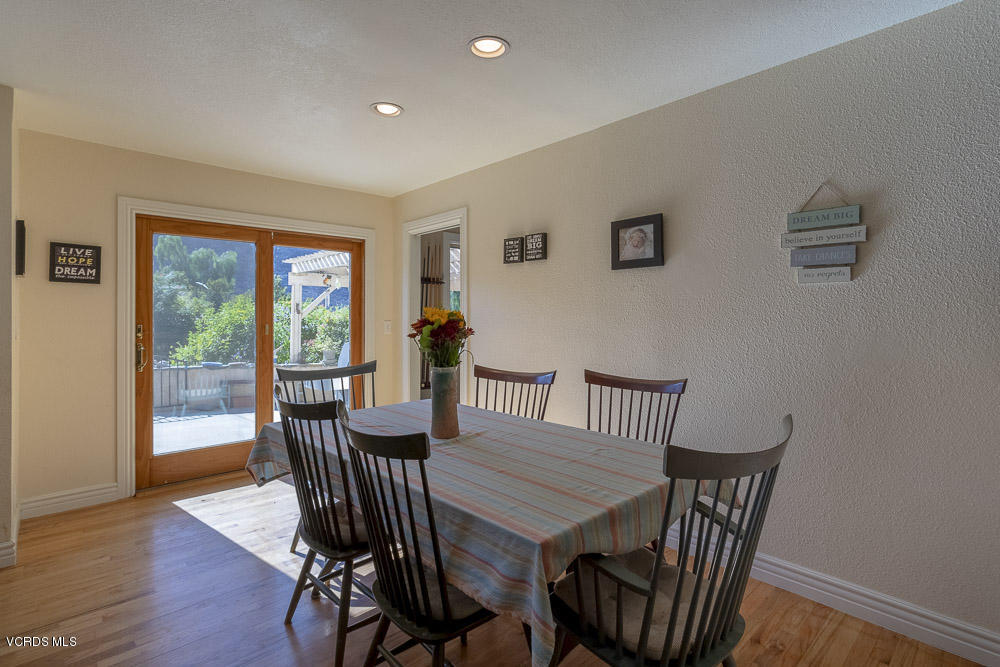 1168 Rambling Road Simi Valley, CA 93065 - Photo 14 of 45 a view of a dining room with furniture window and wooden floor