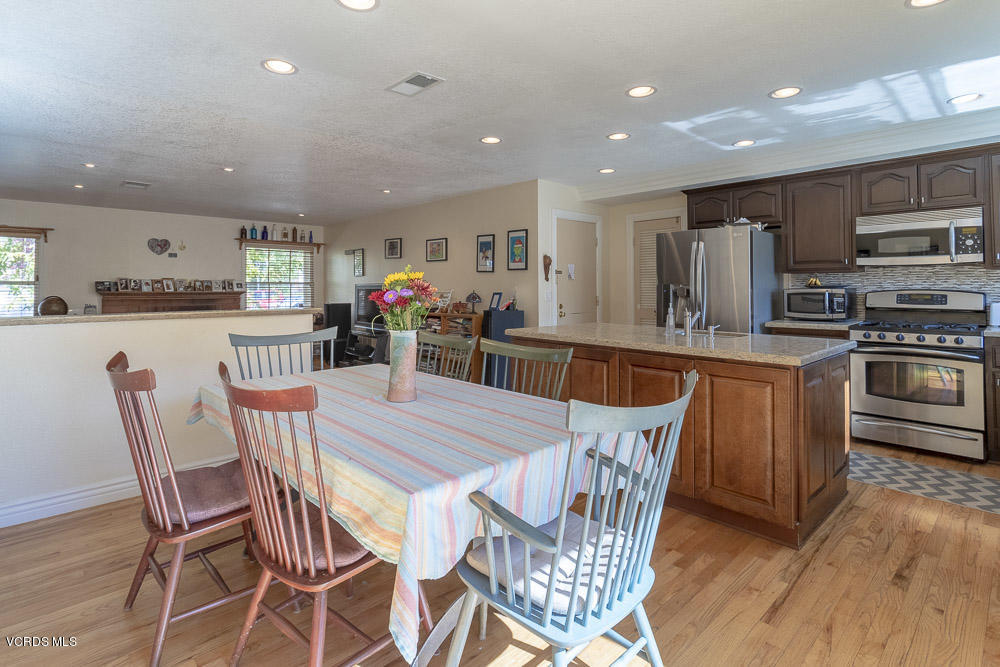 1168 Rambling Road Simi Valley, CA 93065 - Photo 15 of 45 a view of a dining room with furniture and wooden floor
