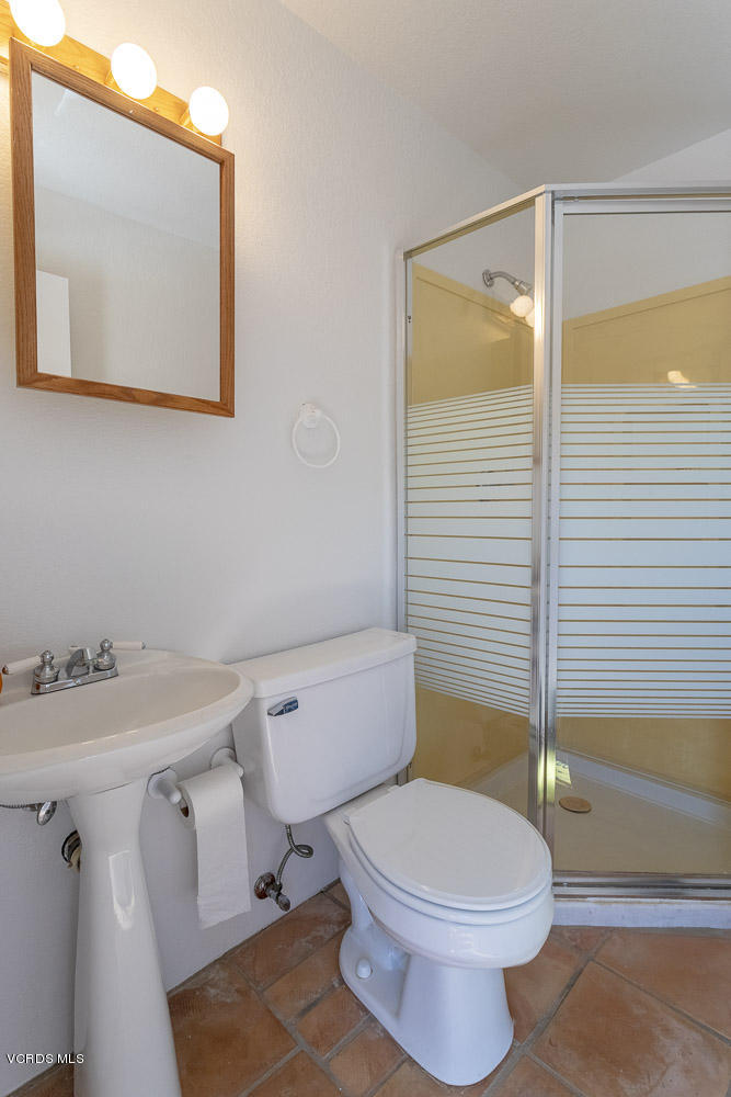 1168 Rambling Road Simi Valley, CA 93065 - Photo 18 of 45 a bathroom with a toilet a sink and shower