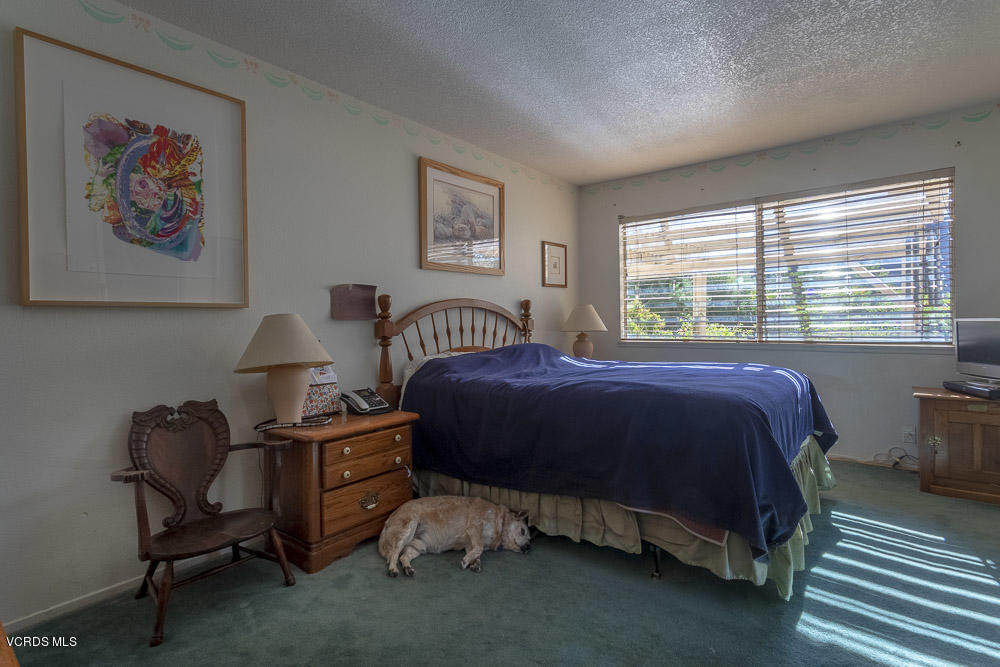 1168 Rambling Road Simi Valley, CA 93065 - Photo 19 of 45 a bedroom with a bed and a desk