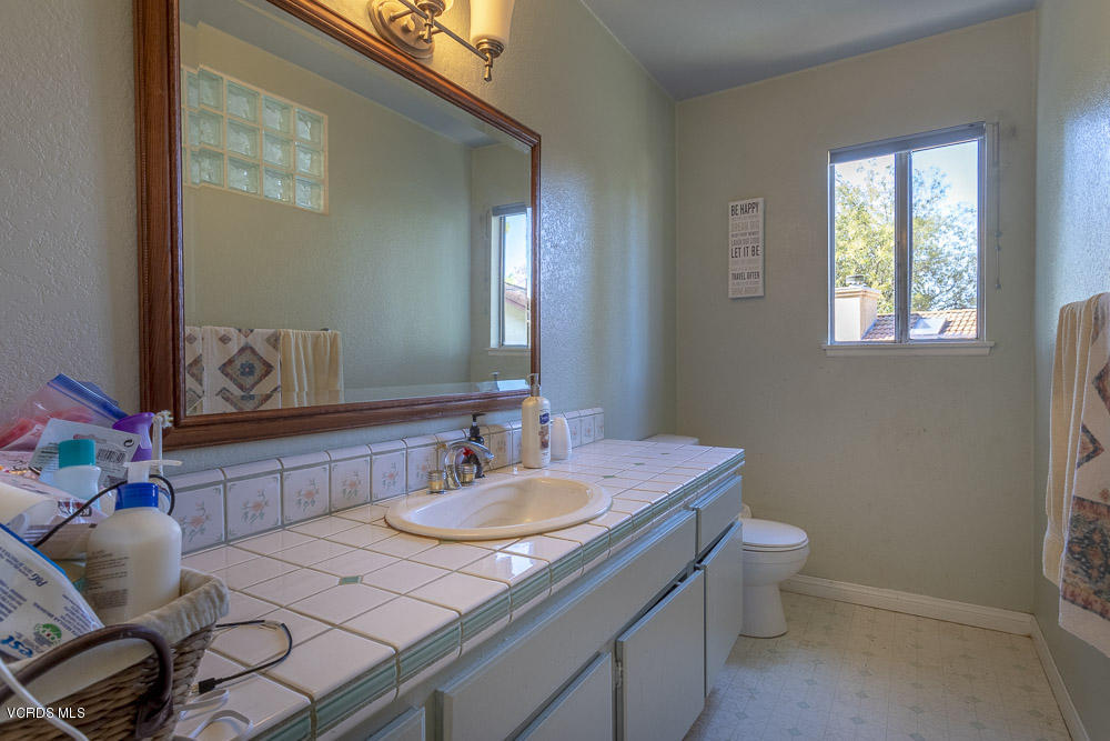 1168 Rambling Road Simi Valley, CA 93065 - Photo 20 of 45 a bathroom with a sink and a mirror