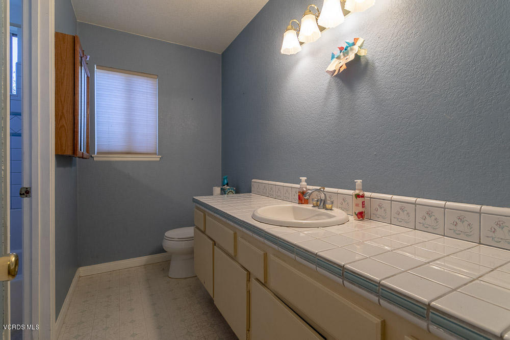 1168 Rambling Road Simi Valley, CA 93065 - Photo 21 of 45 a bathroom with a sink and a toilet