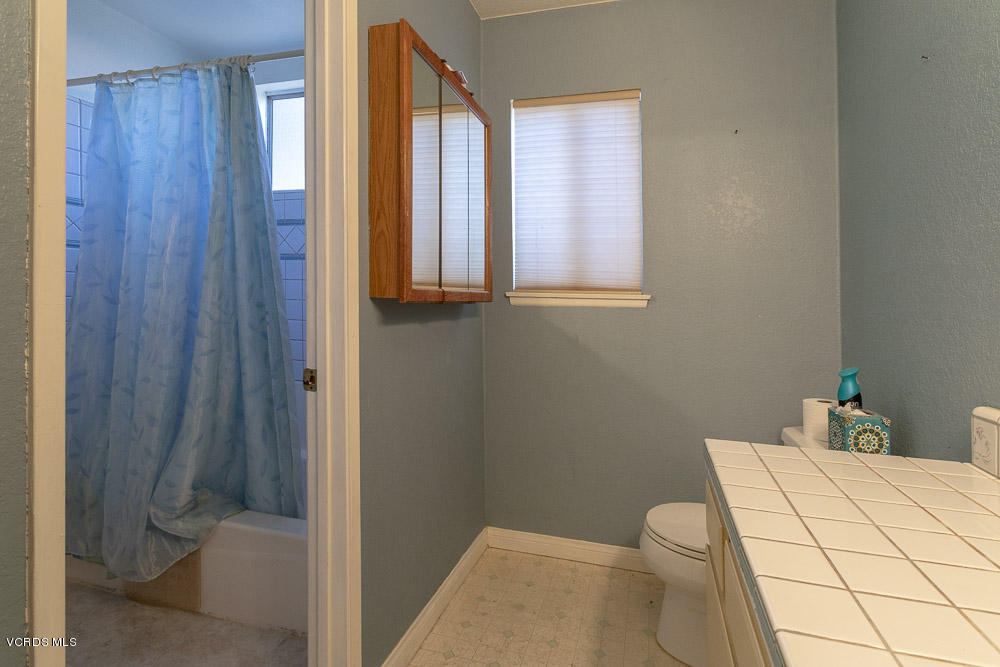 1168 Rambling Road Simi Valley, CA 93065 - Photo 22 of 45 a bathroom with a toilet and a shower