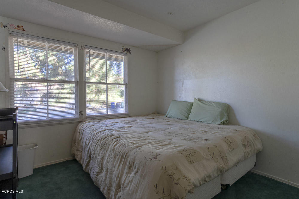 1168 Rambling Road Simi Valley, CA 93065 - Photo 23 of 45 a bed sitting in a bedroom next to a window