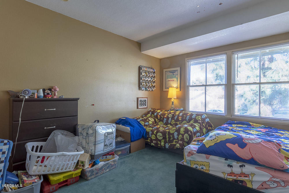 1168 Rambling Road Simi Valley, CA 93065 - Photo 24 of 45 a bedroom with bed and a window