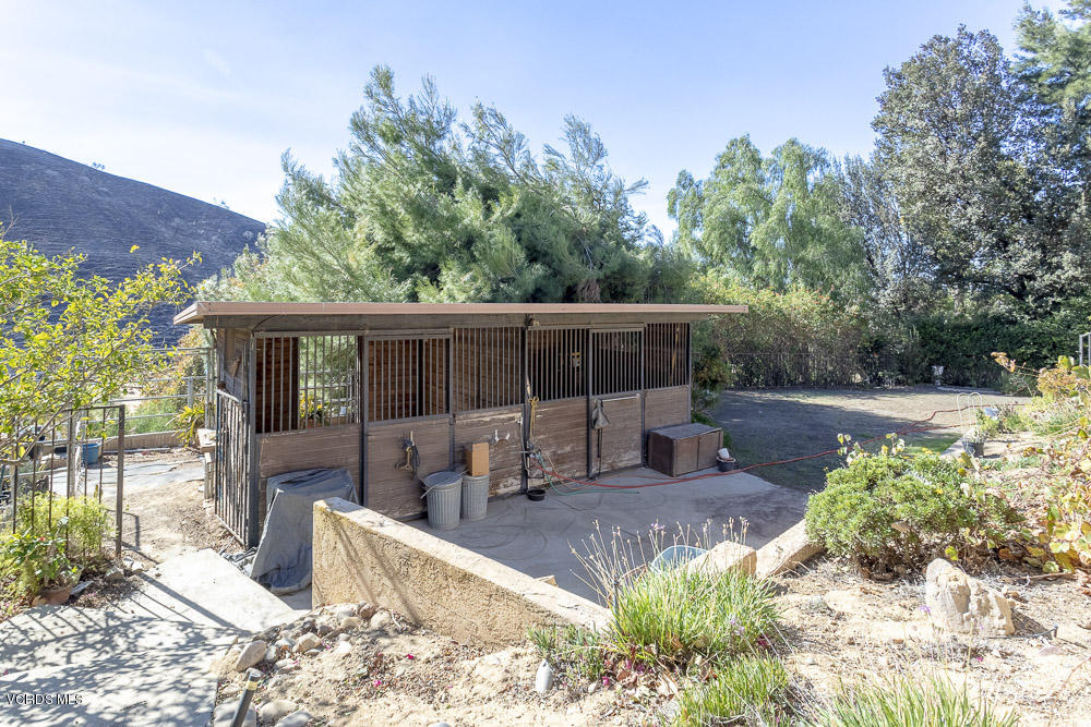 1168 Rambling Road Simi Valley, CA 93065 - Photo 32 of 45 a view of a patio with table and chairs potted plants with wooden floor