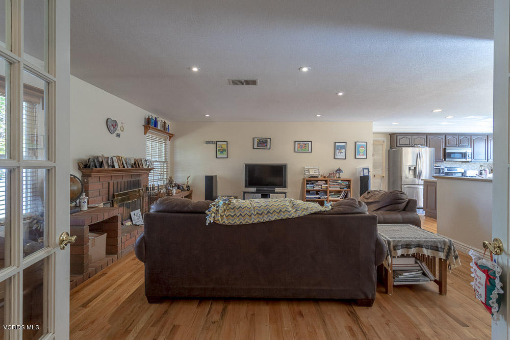 1168 Rambling Road Simi Valley, CA 93065 - Photo 5 of 45 a living room with furniture and a flat screen tv