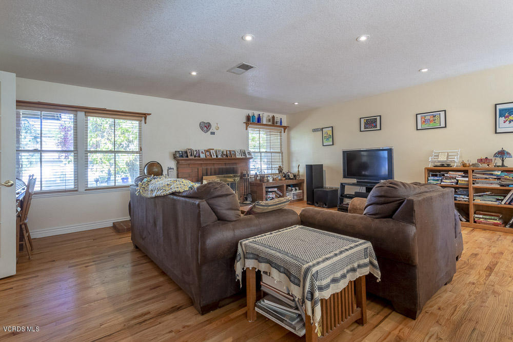 1168 Rambling Road Simi Valley, CA 93065 - Photo 6 of 45 a living room with furniture and a flat screen tv