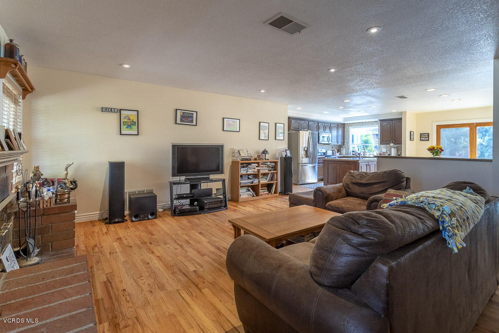 1168 Rambling Road Simi Valley, CA 93065 - Photo 7 of 45 a living room with furniture and a flat screen tv