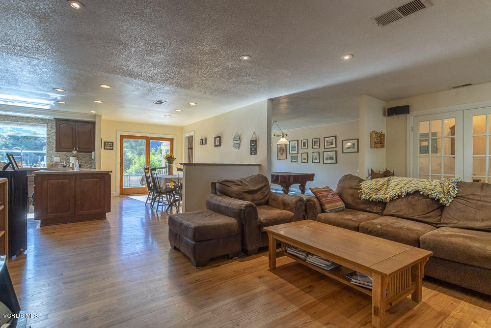 1168 Rambling Road Simi Valley, CA 93065 - Photo 8 of 45 a living room with furniture and wooden floor