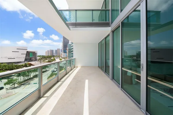 a view of balcony with furniture