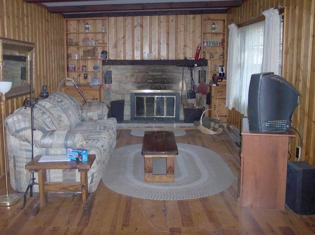 205 Cedar Road Effort, PA 18330 - Photo 2 of 7 a living room with furniture and a fireplace