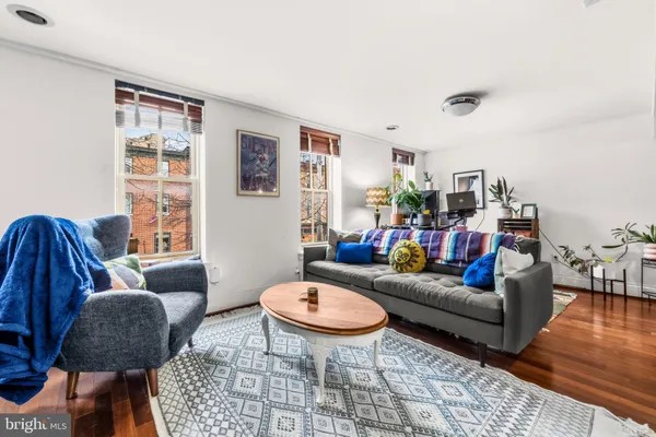 a living room with furniture and a rug