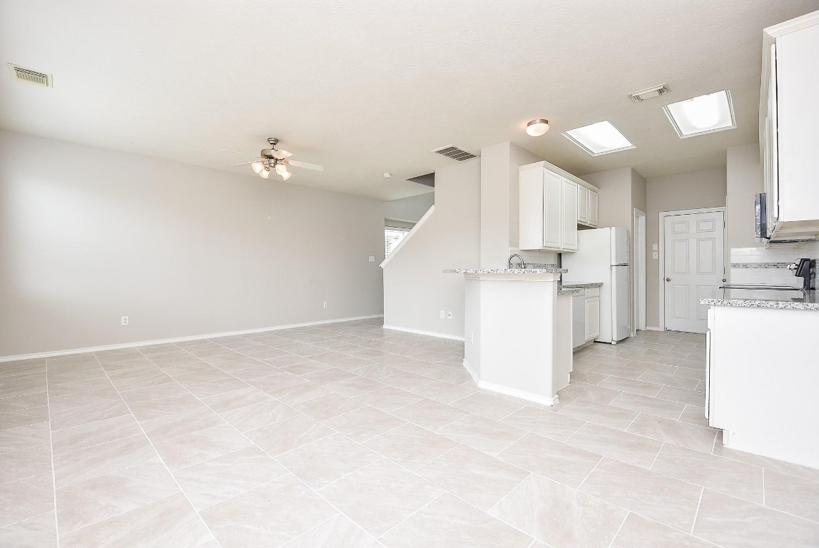 5619 Stonecloud Lane Katy, TX 77494 - Photo 11 of 31 a view of a kitchen with a sink