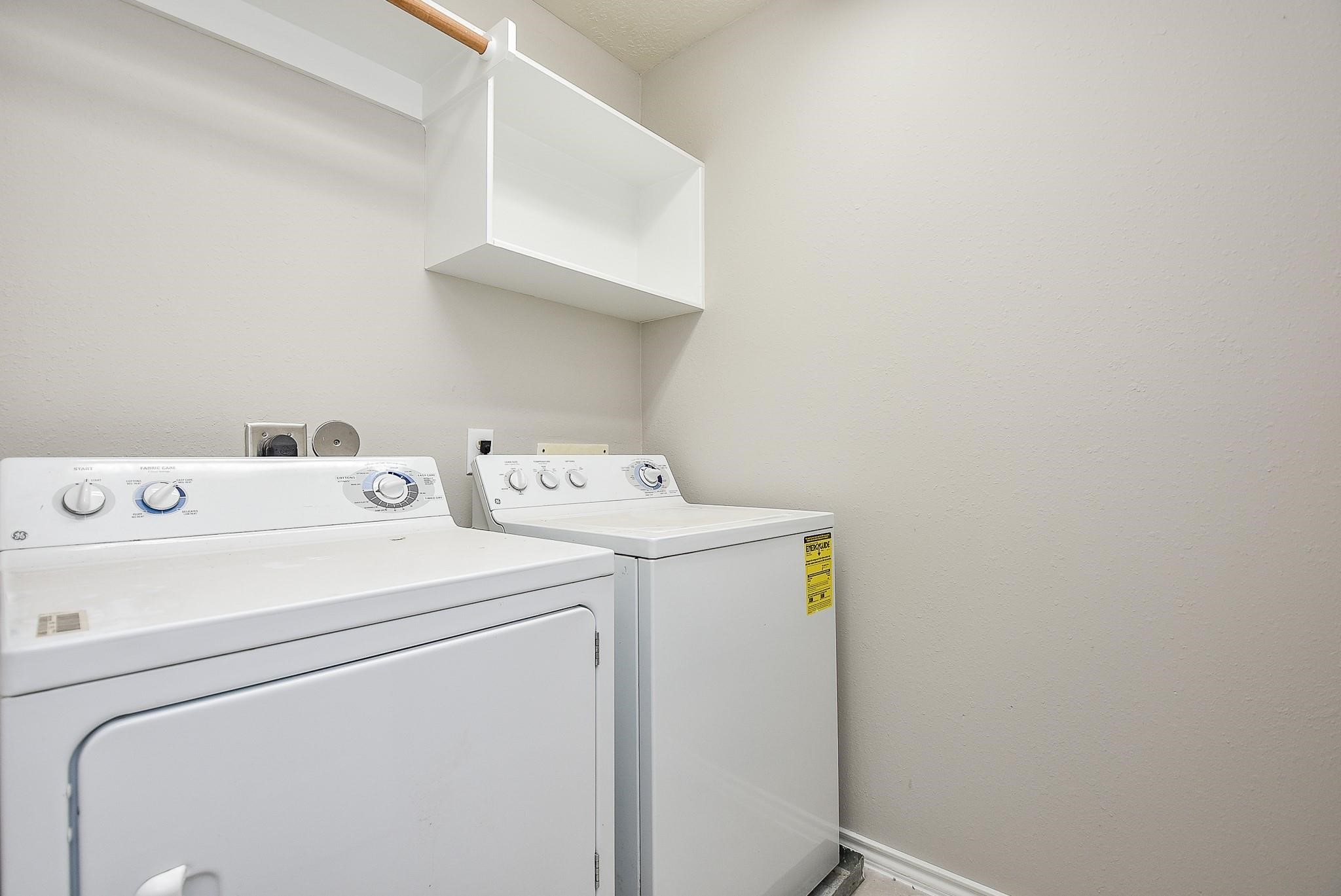5619 Stonecloud Lane Katy, TX 77494 - Photo 20 of 31 a utility room with dryer and washer