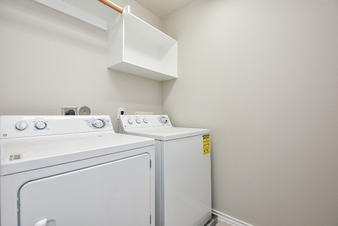 5619 Stonecloud Lane Katy, TX 77494 - Photo 20 of 31 a utility room with dryer and washer