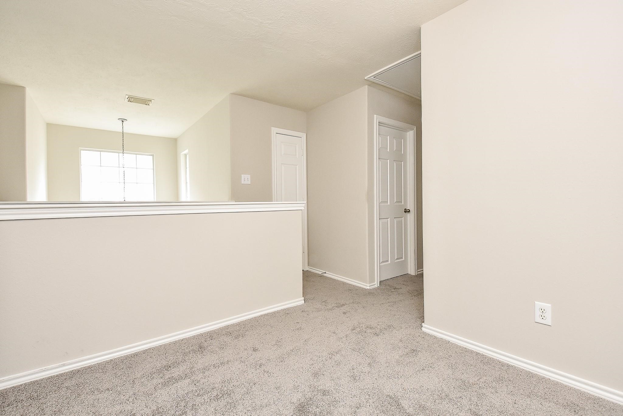 5619 Stonecloud Lane Katy, TX 77494 - Photo 22 of 31 an empty room with windows