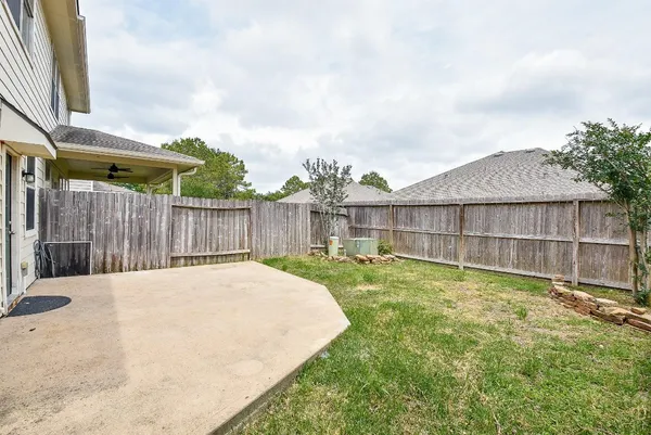 a swimming pool with wooden fence