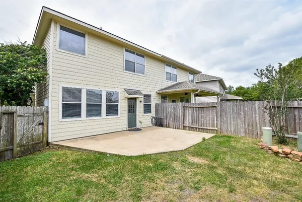 a front view of house with a garden