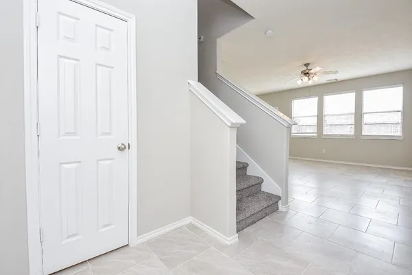 an entryway in a hall with a window