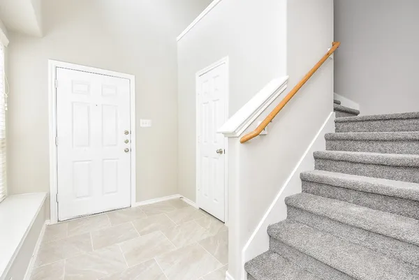 a view of staircase with white walls and white walls
