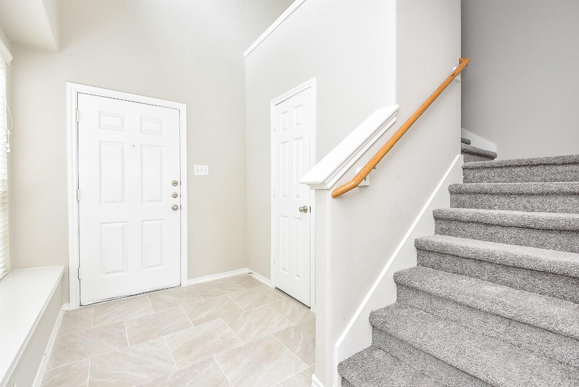 5619 Stonecloud Lane Katy, TX 77494 - Photo 5 of 31 a view of staircase with white walls and white walls