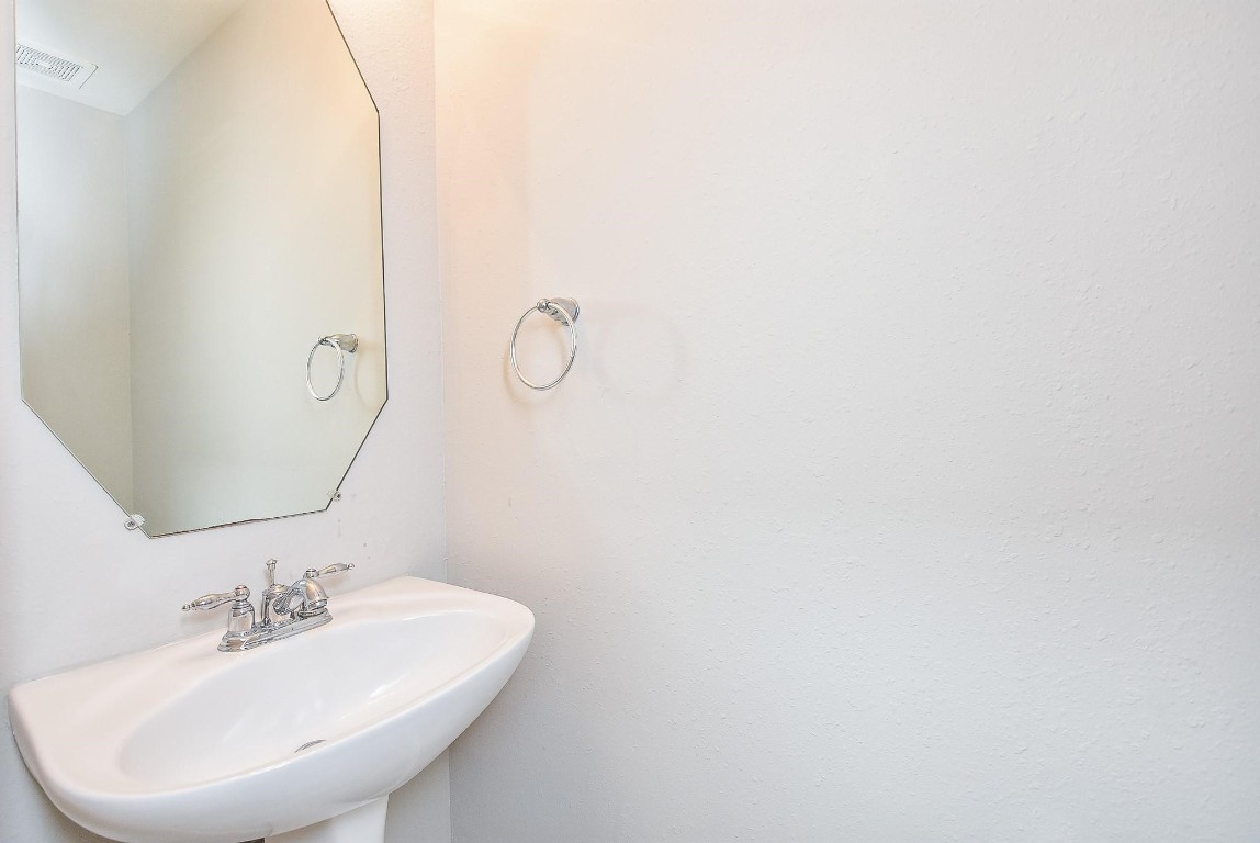 5619 Stonecloud Lane Katy, TX 77494 - Photo 6 of 31 a bathroom with a sink and mirror