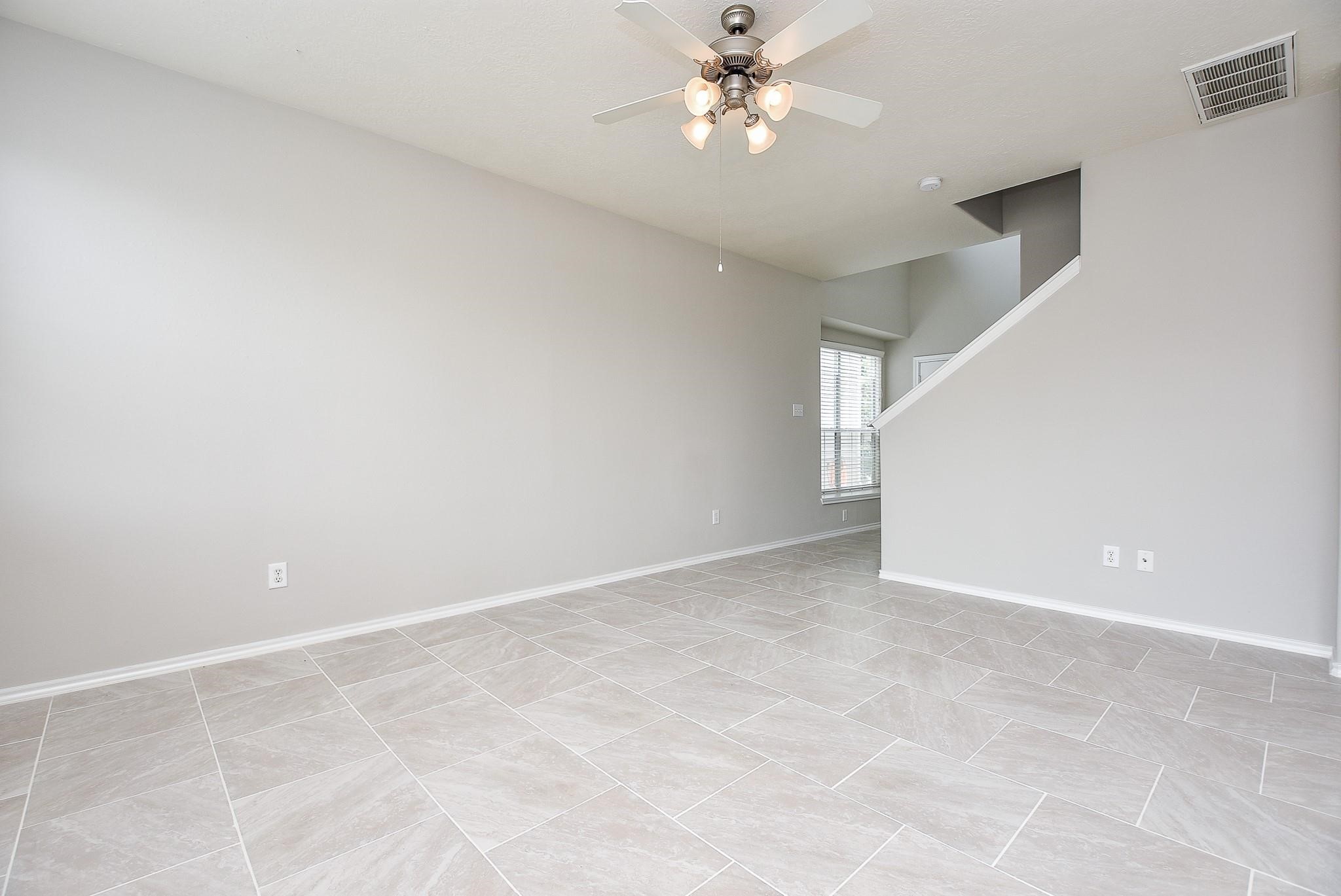 5619 Stonecloud Lane Katy, TX 77494 - Photo 7 of 31 a view of an empty room with a window