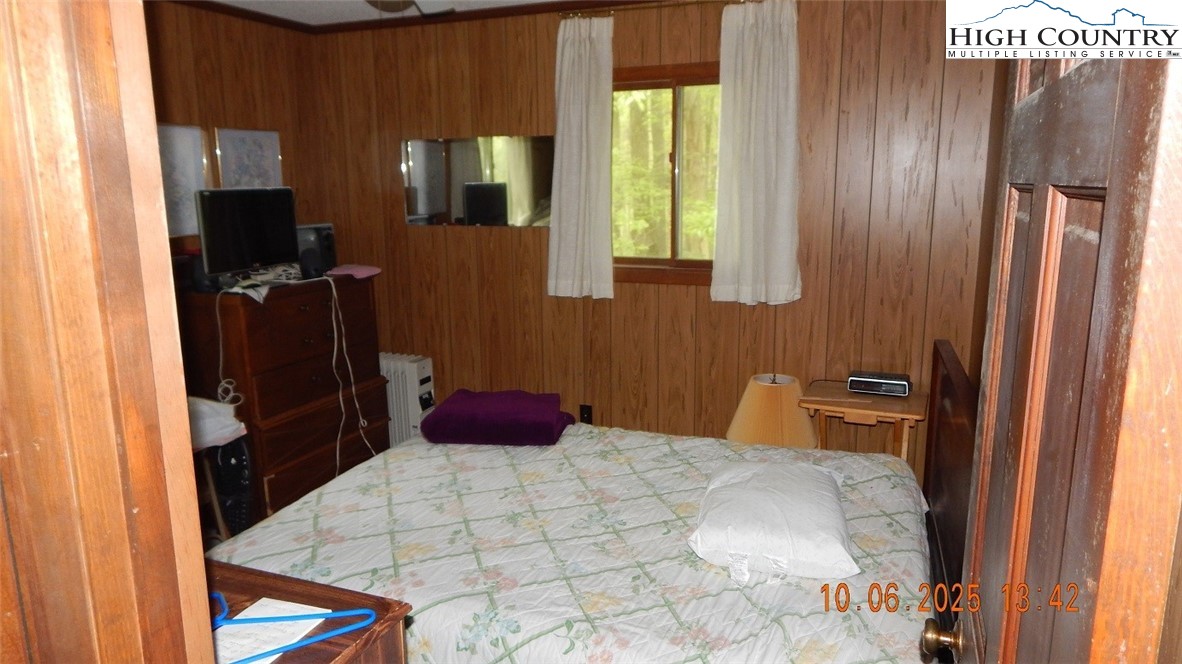5359 Castle Ford Road Boone, NC 28607 - Photo 5 of 11 a bedroom with a bed and a dresser