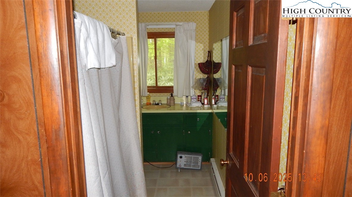 5359 Castle Ford Road Boone, NC 28607 - Photo 6 of 11 a bathroom with sink and mirror