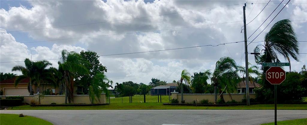 0 Northwest South Shore Road Stuart, FL 34994 - Photo 3 of 9 a street with a building in the background