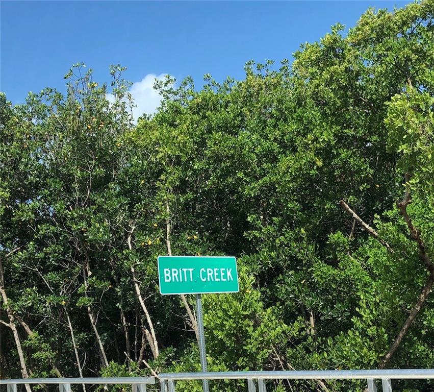 0 Northwest South Shore Road Stuart, FL 34994 - Photo 7 of 9 a sign that is sitting on a pole