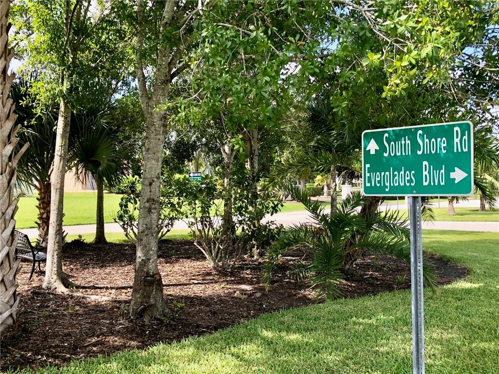 0 Northwest South Shore Road Stuart, FL 34994 - Photo 8 of 9 a sign that is sitting in front of a tree