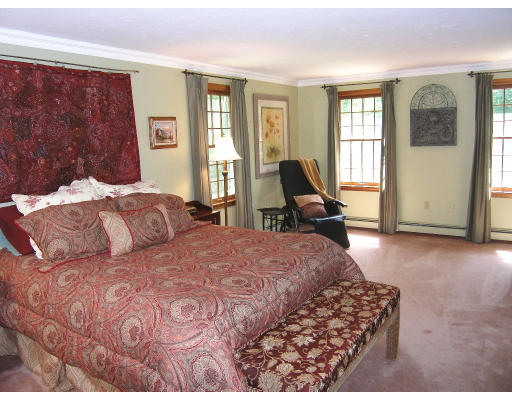 18 Parmenter Road Framingham, MA 01701 - Photo 14 of 18 a bedroom with a bed and glass windows