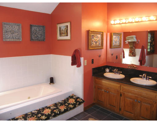 18 Parmenter Road Framingham, MA 01701 - Photo 15 of 18 a bathroom with a tub sink and mirror