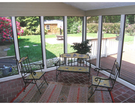 18 Parmenter Road Framingham, MA 01701 - Photo 18 of 18 a living room with furniture and a floor to ceiling window