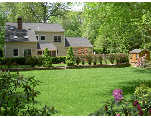 18 Parmenter Road Framingham, MA 01701 - Photo 3 of 18 a front view of house with yard and green space