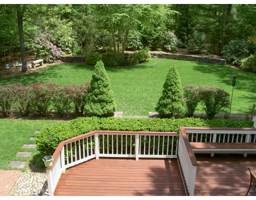 18 Parmenter Road Framingham, MA 01701 - Photo 4 of 18 a view of a wooden deck with a yard