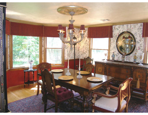 18 Parmenter Road Framingham, MA 01701 - Photo 9 of 18 a dining room with wooden floor a chandelier a wooden table and chairs
